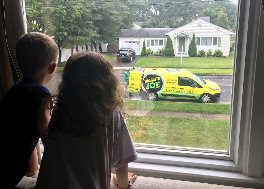 Children are excited to see a Mosquito Joe Service van and technician appear in front of their Connecticut home.